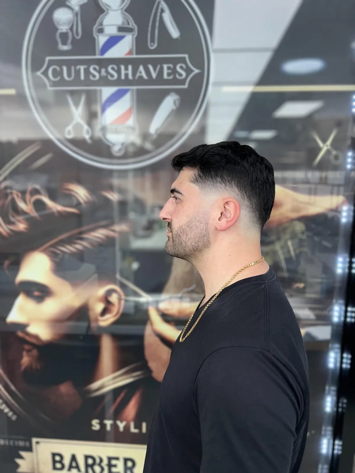 Client with a sharp regular haircut at Plaza Barber Shop West Hempstead