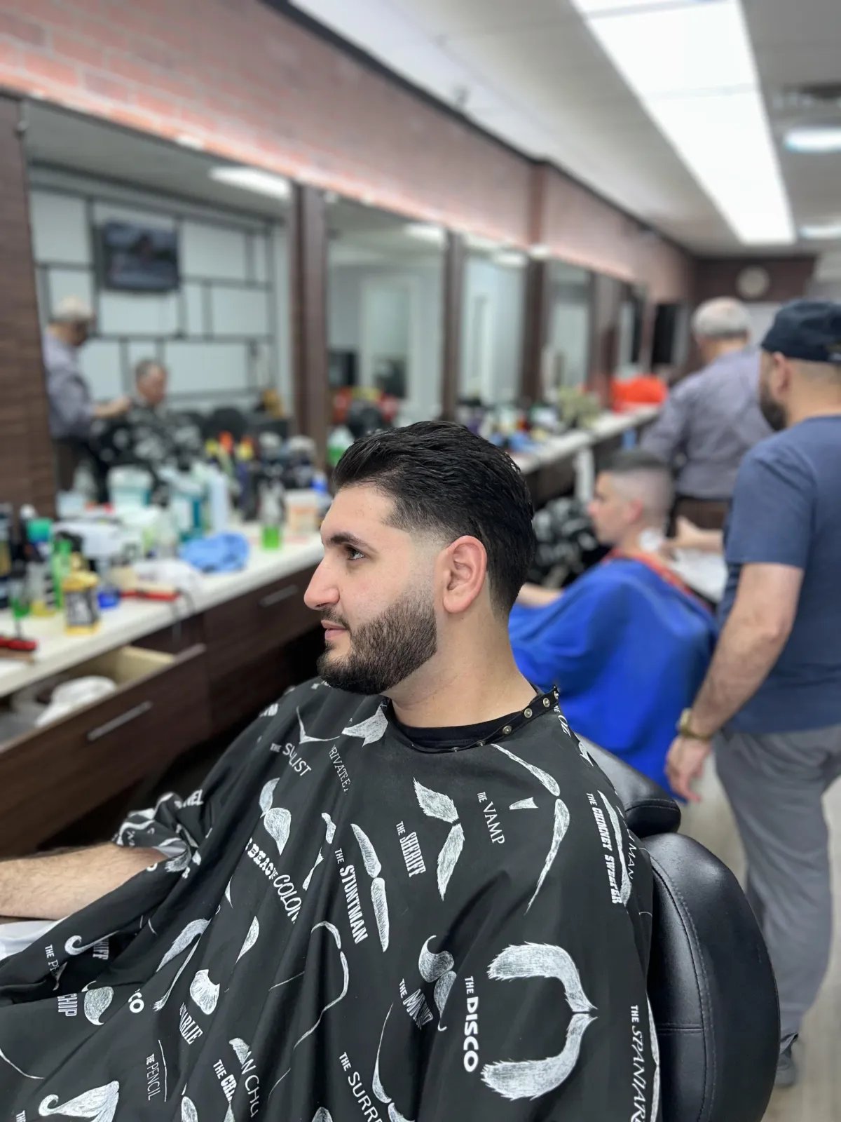 Sharp skin fade cut at Plaza Barber Shop on Hempstead Turnpike